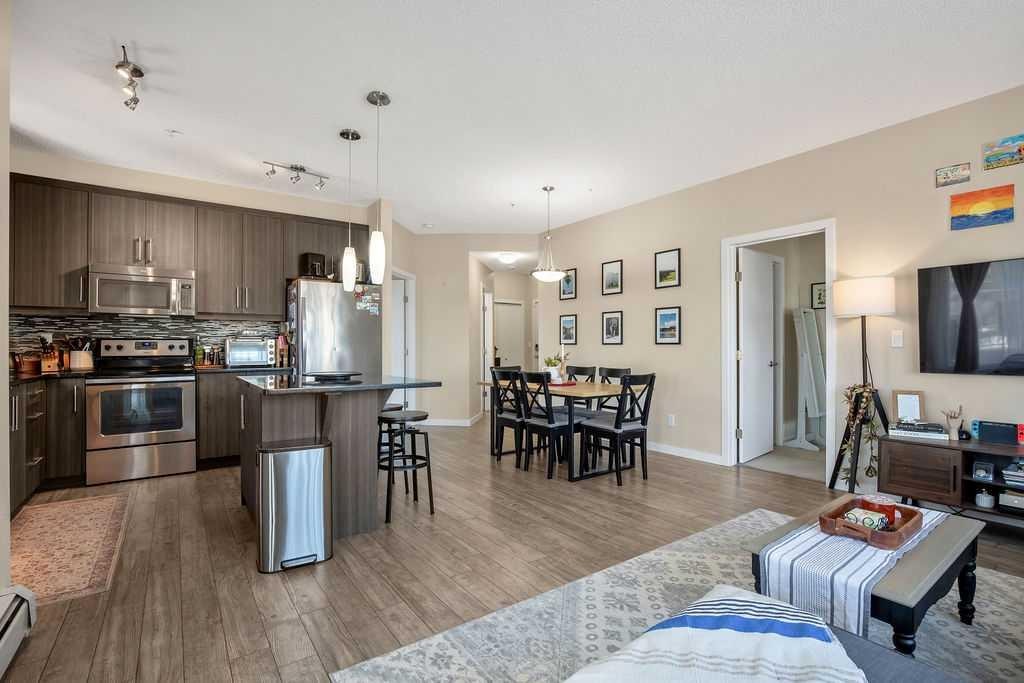 321-402 Marquis Lane Se, Calgary, AB - Indoor Photo Showing Kitchen With Stainless Steel Kitchen