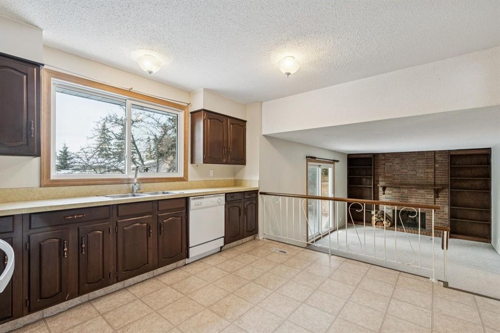219 Silvercreek Close Nw, Calgary, AB - Indoor Photo Showing Kitchen With Double Sink