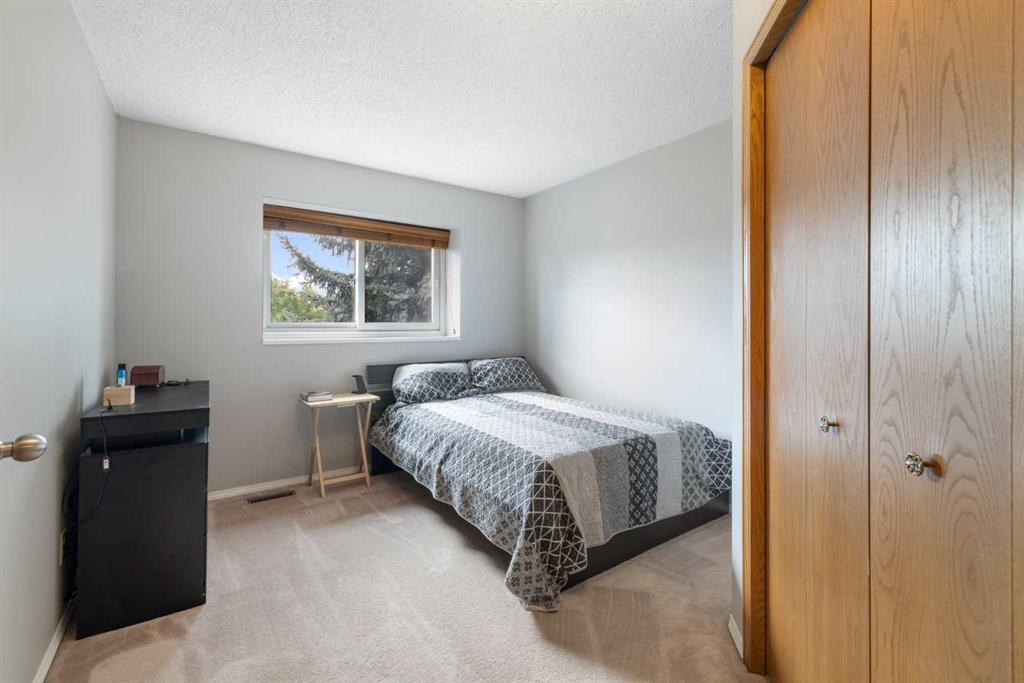 156 Woodfield Road Sw, Calgary, AB - Indoor Photo Showing Bedroom