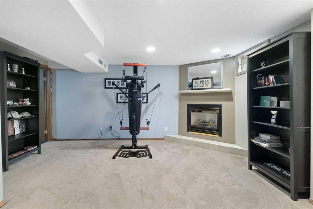 156 Woodfield Road Sw, Calgary, AB - Indoor With Fireplace
