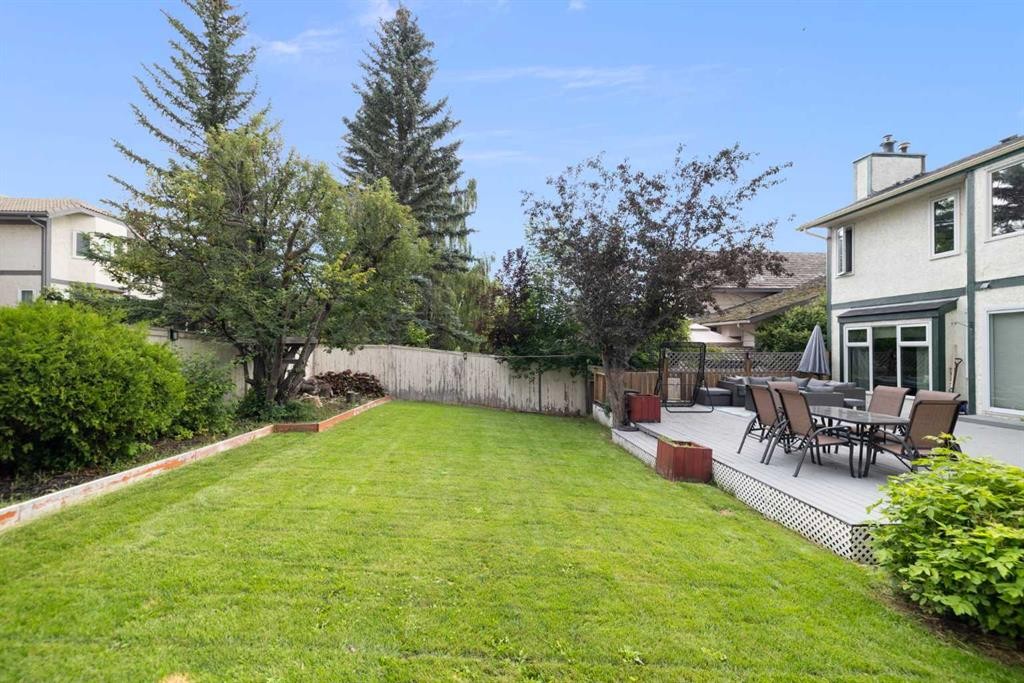 156 Woodfield Road Sw, Calgary, AB - Outdoor With Deck Patio Veranda With Backyard
