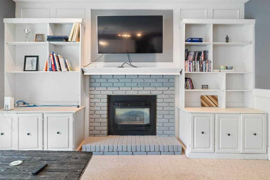 156 Woodfield Road Sw, Calgary, AB - Indoor Photo Showing Living Room With Fireplace