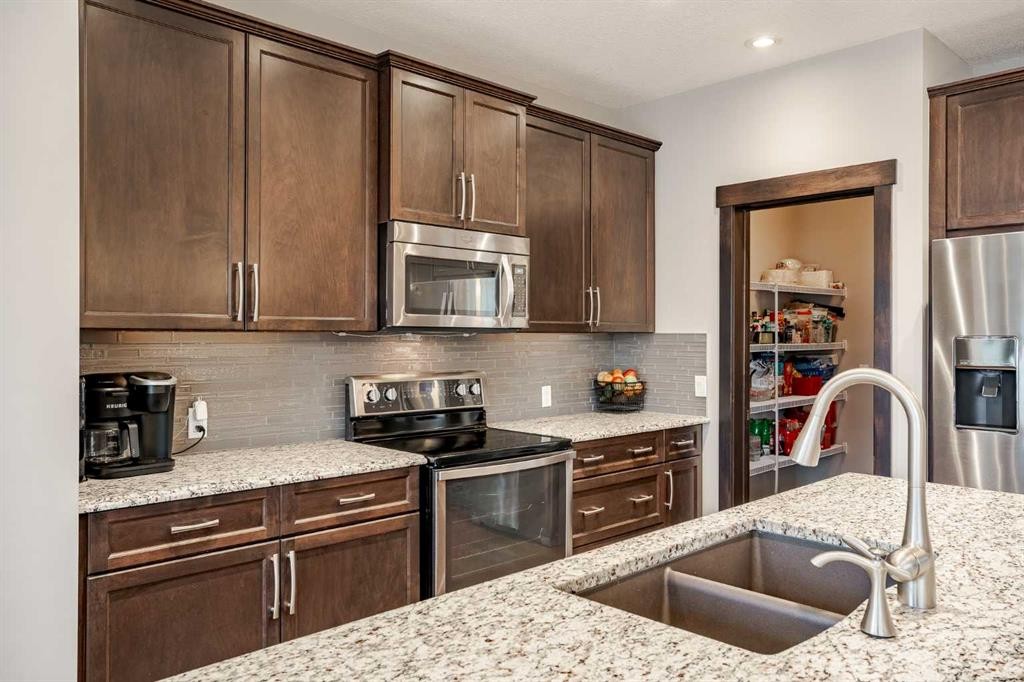 355 Evanston Way Nw, Calgary, AB - Indoor Photo Showing Kitchen With Double Sink With Upgraded Kitchen