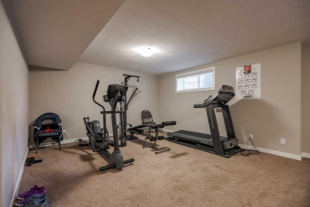 355 Evanston Way Nw, Calgary, AB - Indoor Photo Showing Gym Room