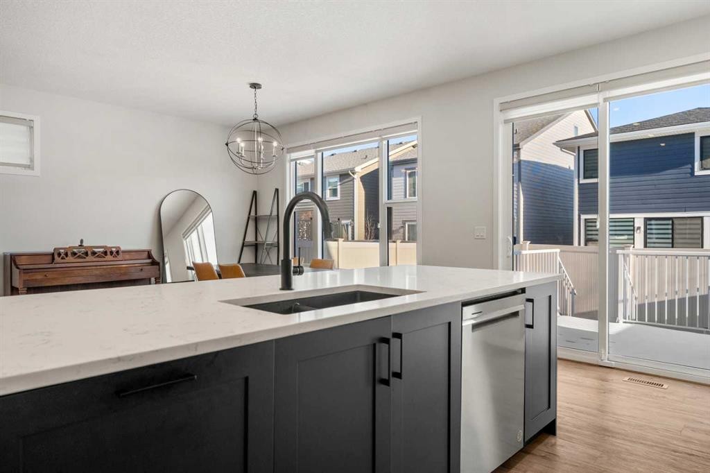 40 West Grove Link Sw, Calgary, AB - Indoor Photo Showing Kitchen With Double Sink