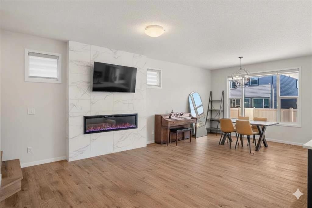 40 West Grove Link Sw, Calgary, AB - Indoor Photo Showing Living Room With Fireplace