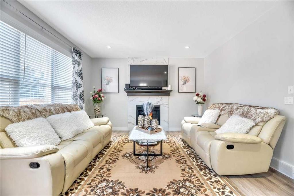 81 Legacy Woods Place Se, Calgary, AB - Indoor Photo Showing Living Room With Fireplace
