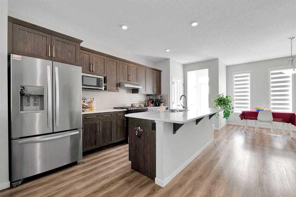 103 Dawson Harbour Hill, Chestermere, AB - Indoor Photo Showing Kitchen With Stainless Steel Kitchen With Upgraded Kitchen