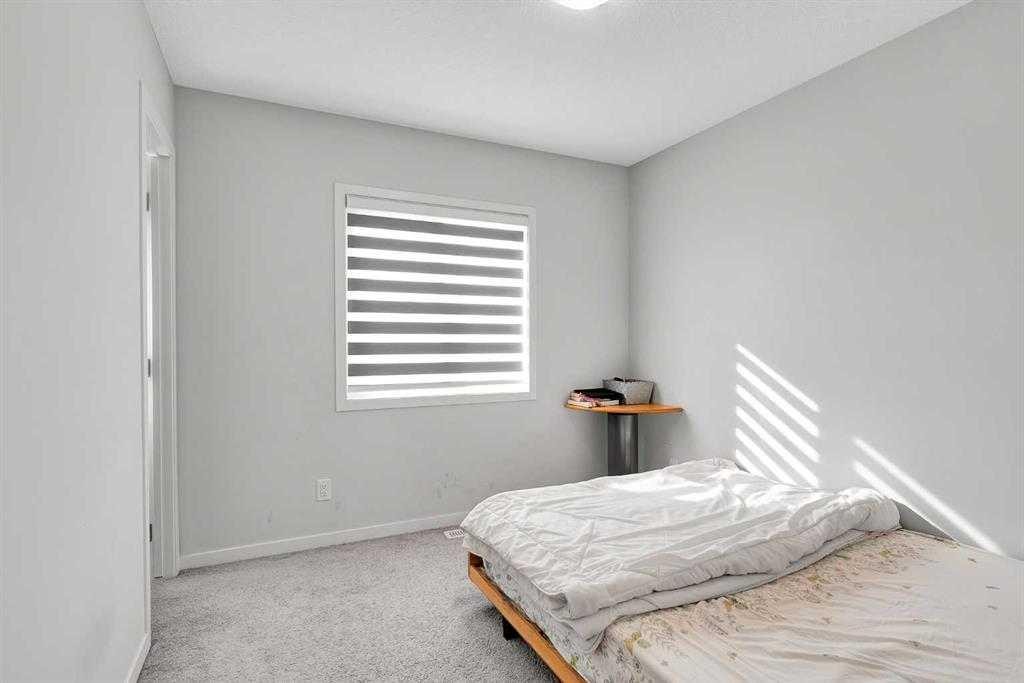 103 Dawson Harbour Hill, Chestermere, AB - Indoor Photo Showing Bedroom
