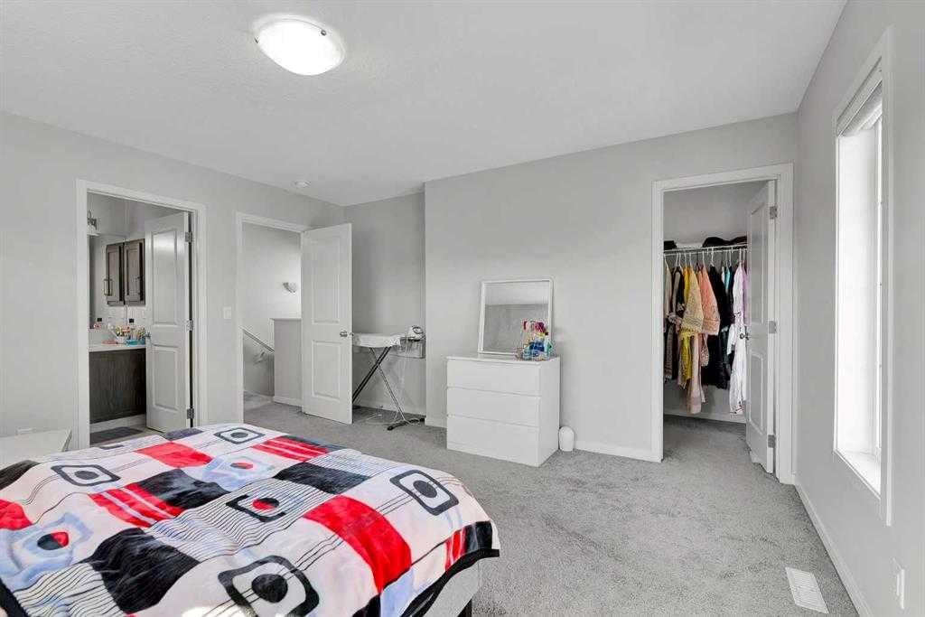 103 Dawson Harbour Hill, Chestermere, AB - Indoor Photo Showing Bedroom