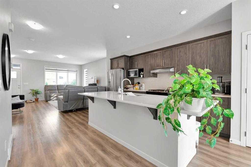 103 Dawson Harbour Hill, Chestermere, AB - Indoor Photo Showing Kitchen With Stainless Steel Kitchen With Upgraded Kitchen