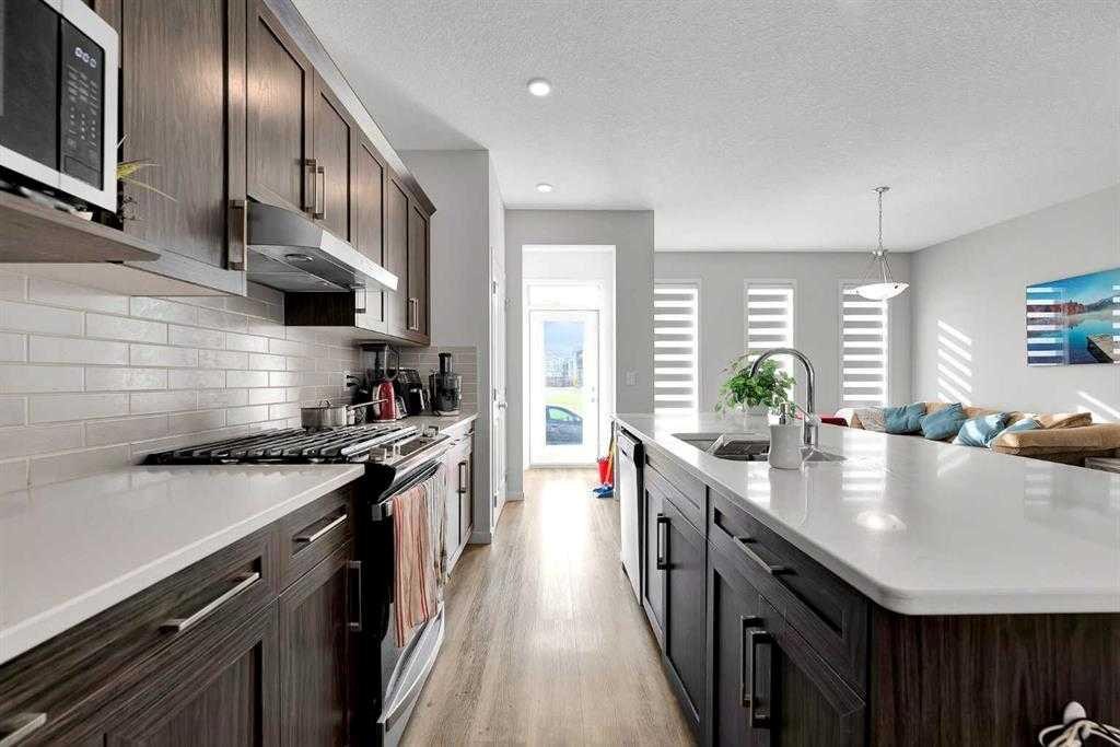 103 Dawson Harbour Hill, Chestermere, AB - Indoor Photo Showing Kitchen With Upgraded Kitchen