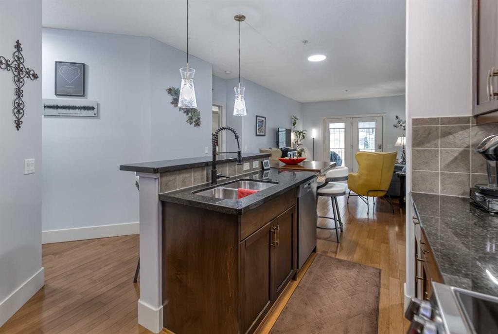 116-77 George Fox Trail, Cochrane, AB - Indoor Photo Showing Kitchen With Double Sink