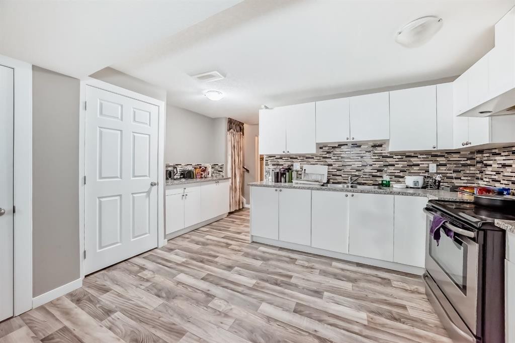 36 Red Embers Row Ne, Calgary, AB - Indoor Photo Showing Kitchen With Double Sink With Upgraded Kitchen
