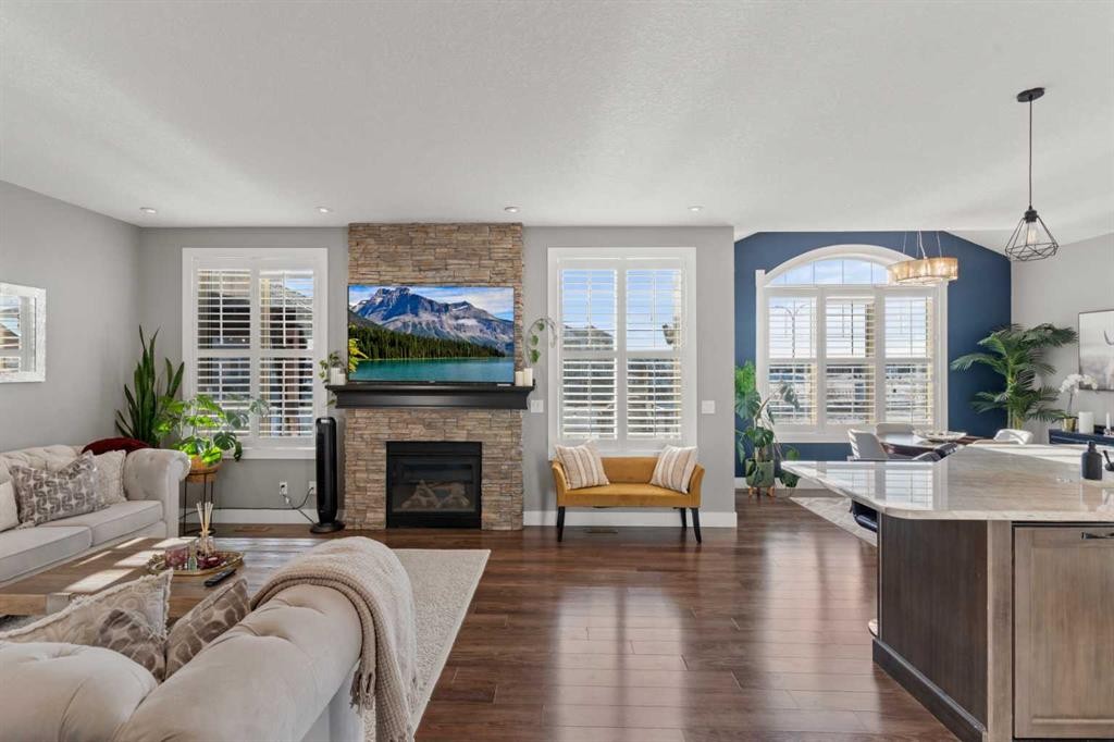 108 Windgate Close Sw, Airdrie, AB - Indoor Photo Showing Living Room With Fireplace