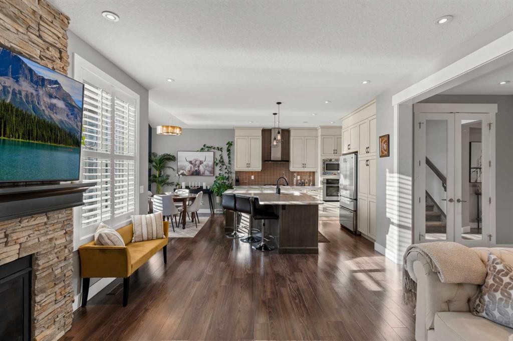 108 Windgate Close Sw, Airdrie, AB - Indoor Photo Showing Living Room With Fireplace