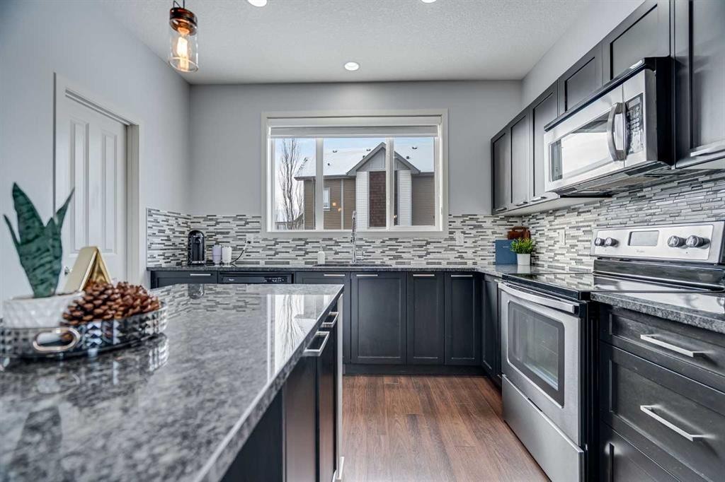 335 Copperpond Row Se, Calgary, AB - Indoor Photo Showing Kitchen With Double Sink With Upgraded Kitchen