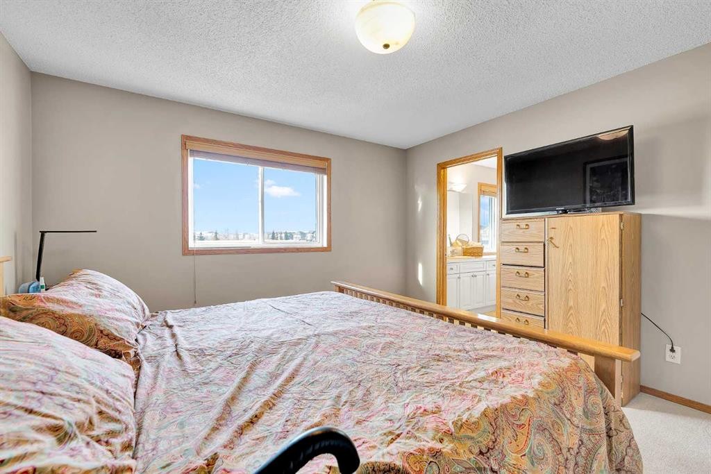 132 Saddletree Close Ne, Calgary, AB - Indoor Photo Showing Bedroom