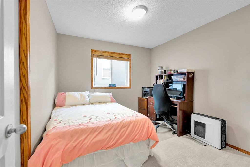 132 Saddletree Close Ne, Calgary, AB - Indoor Photo Showing Bedroom