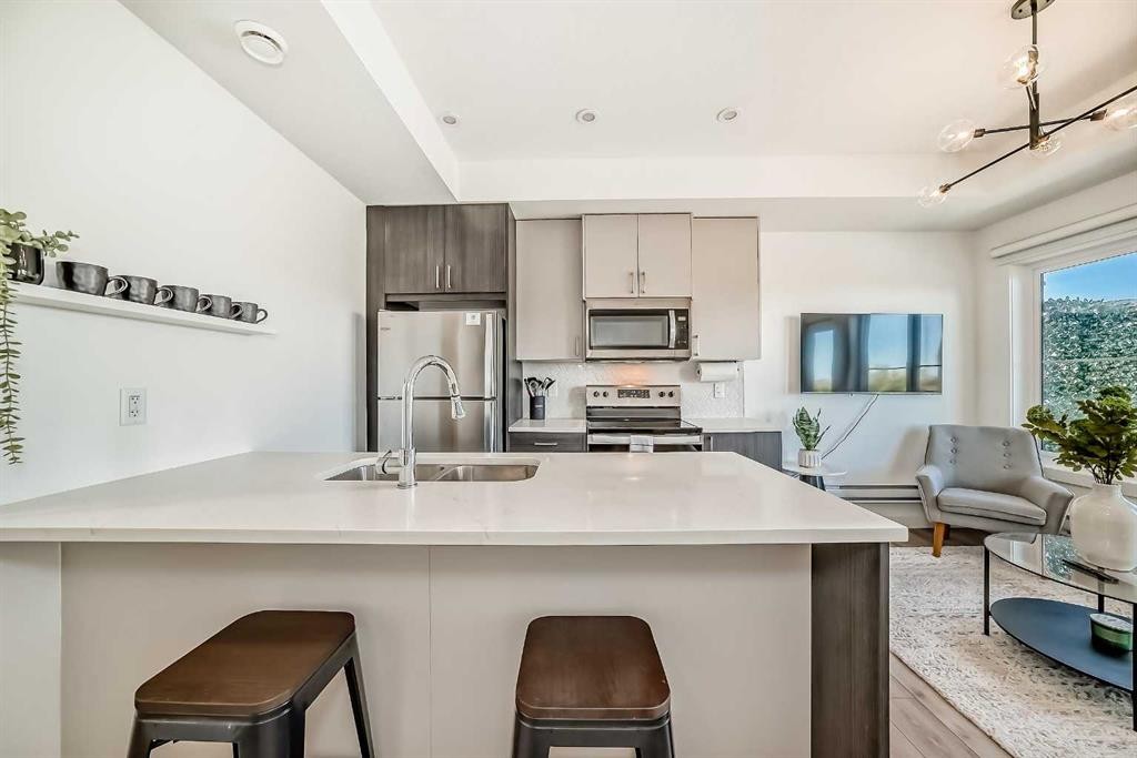 35 Spring Creek Common Sw, Calgary, AB - Indoor Photo Showing Kitchen With Double Sink With Upgraded Kitchen