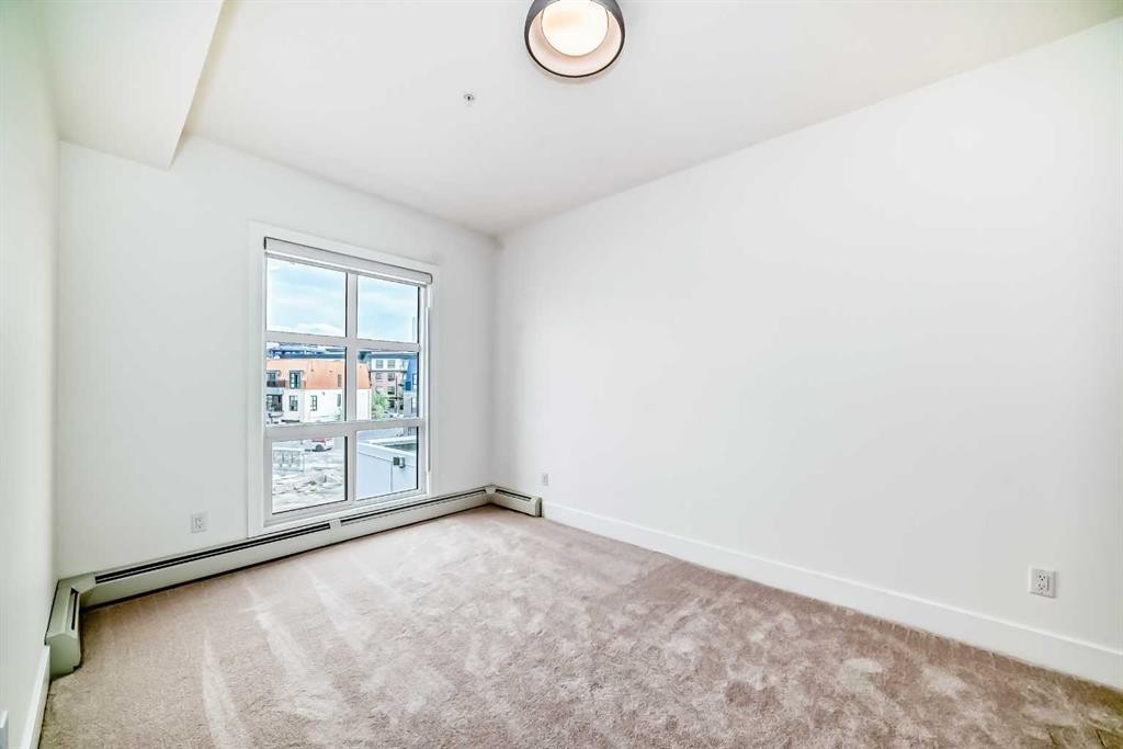 1319-4270 Norford Avenue Nw, Calgary, AB - Indoor Photo Showing Other Room