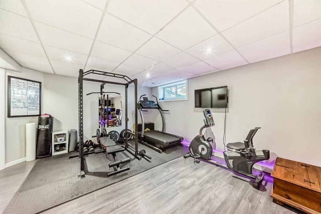 8-122 Bow Ridge Crescent, Cochrane, AB - Indoor Photo Showing Gym Room