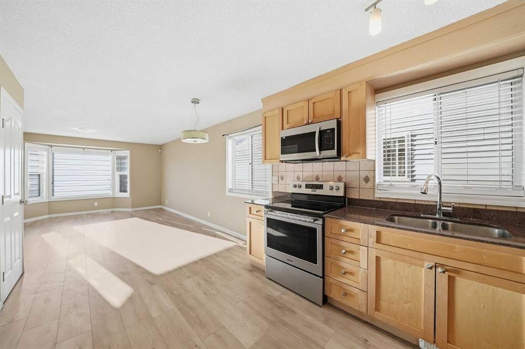 30 Falmere Way Ne, Calgary, AB - Indoor Photo Showing Kitchen With Double Sink