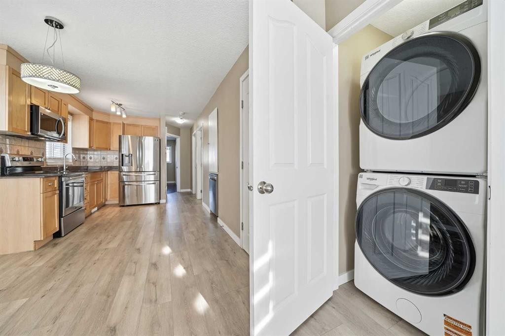 30 Falmere Way Ne, Calgary, AB - Indoor Photo Showing Laundry Room