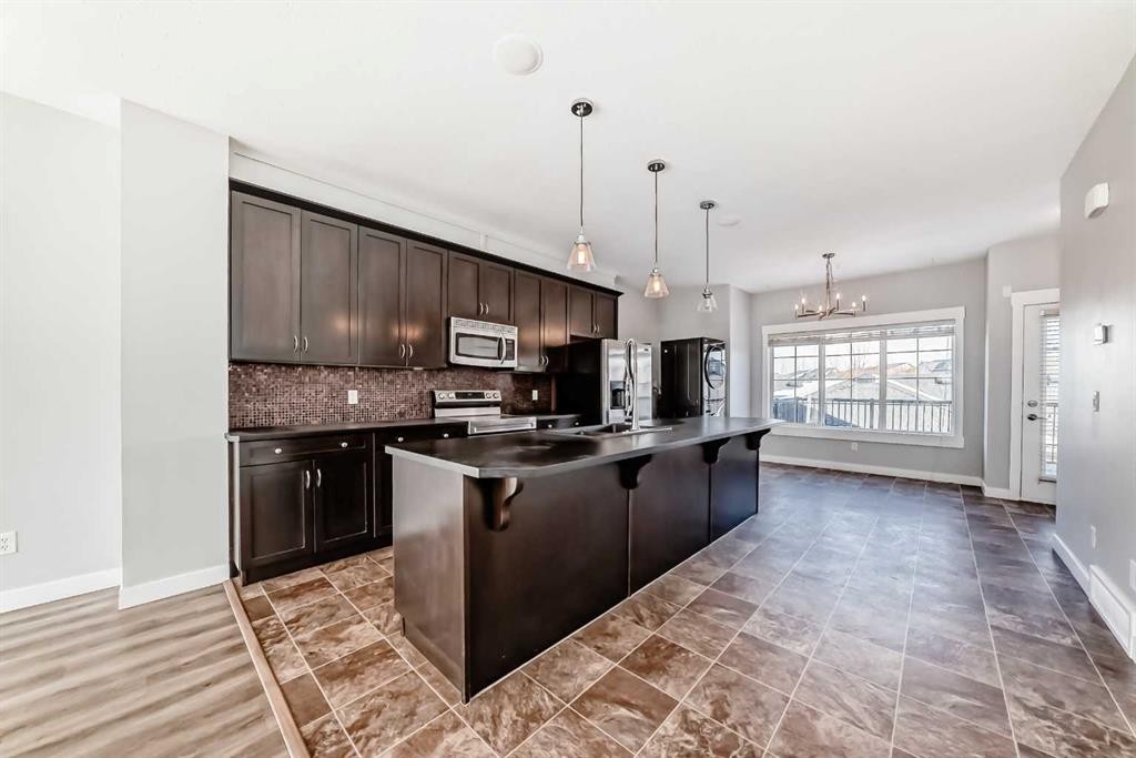 397 Rainbow Falls Drive, Chestermere, AB - Indoor Photo Showing Kitchen With Upgraded Kitchen