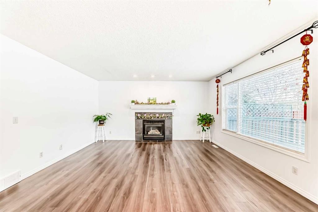 71 Millrise Square Sw, Calgary, AB - Indoor Photo Showing Living Room With Fireplace