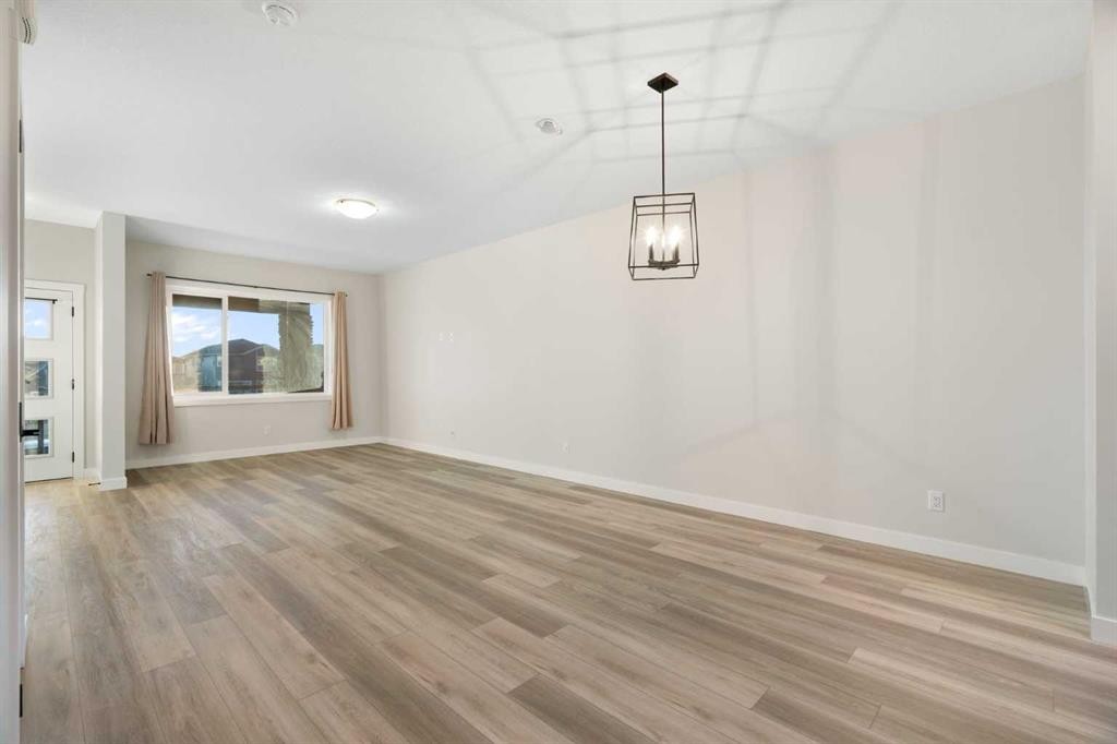 99 Edith Passage Nw, Calgary, AB - Indoor Photo Showing Other Room