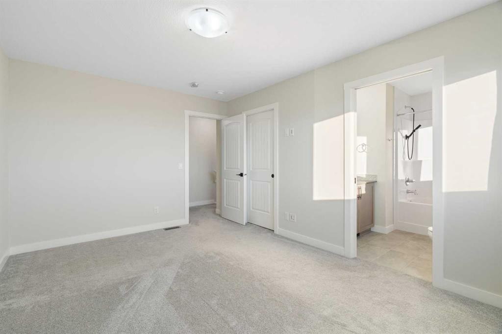 99 Edith Passage Nw, Calgary, AB - Indoor Photo Showing Other Room