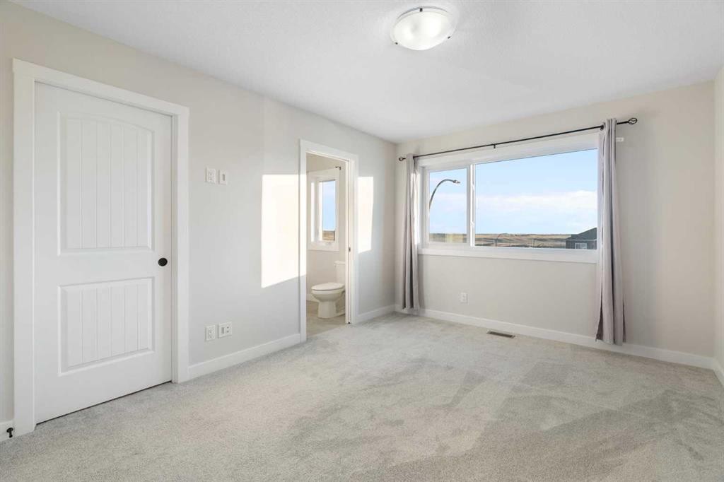 99 Edith Passage Nw, Calgary, AB - Indoor Photo Showing Other Room