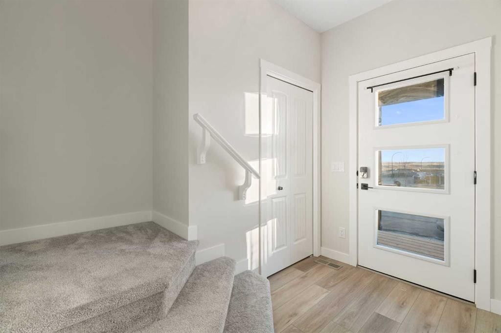 99 Edith Passage Nw, Calgary, AB - Indoor Photo Showing Other Room