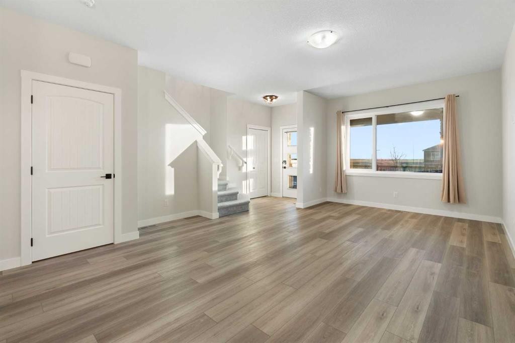 99 Edith Passage Nw, Calgary, AB - Indoor Photo Showing Other Room