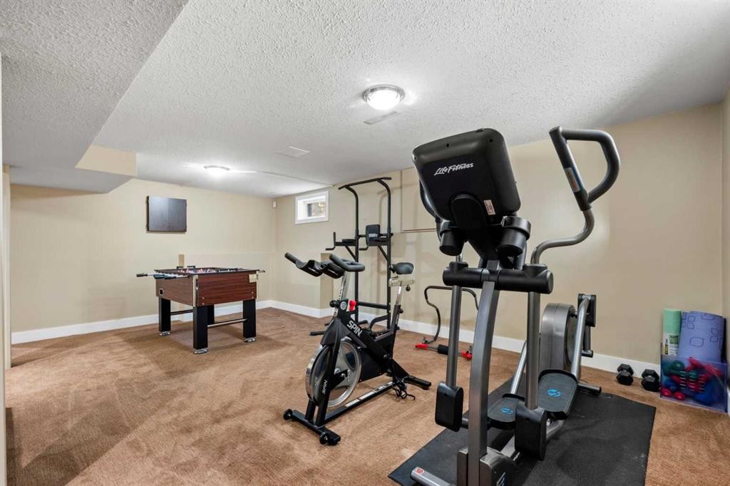 612 Willoughby Crescent Se, Calgary, AB - Indoor Photo Showing Gym Room