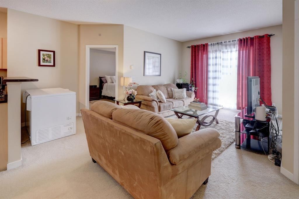 1413-1140 Taradale Drive Ne, Calgary, AB - Indoor Photo Showing Living Room