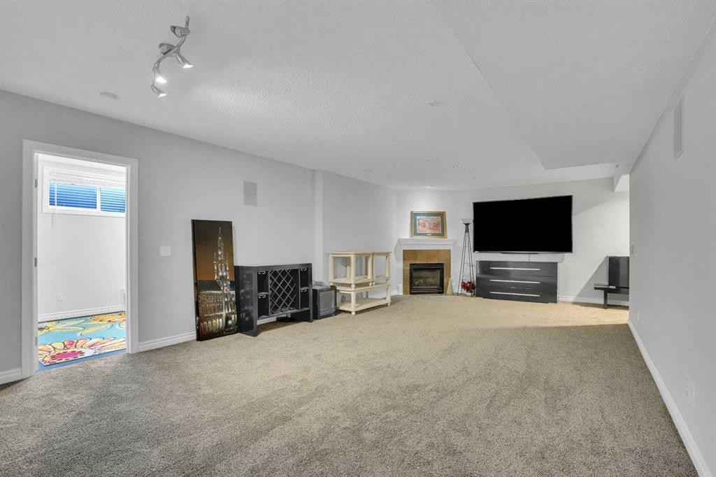 74 Cranleigh Green Se, Calgary, AB - Indoor With Fireplace