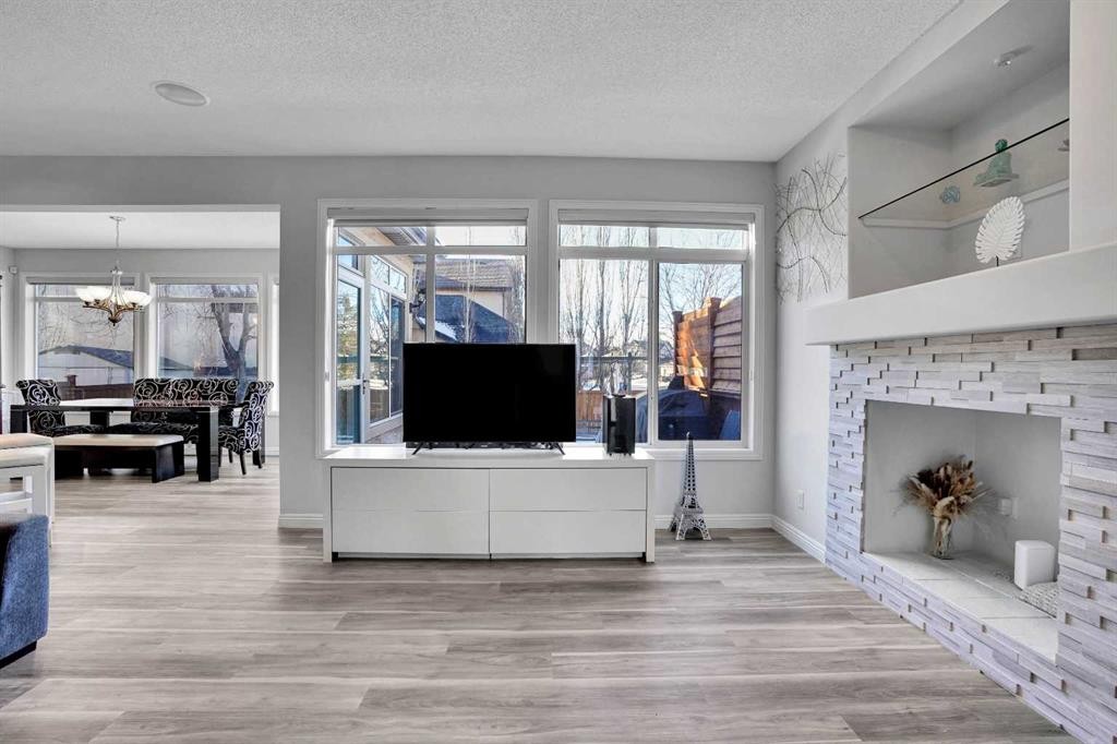 74 Cranleigh Green Se, Calgary, AB - Indoor Photo Showing Living Room With Fireplace