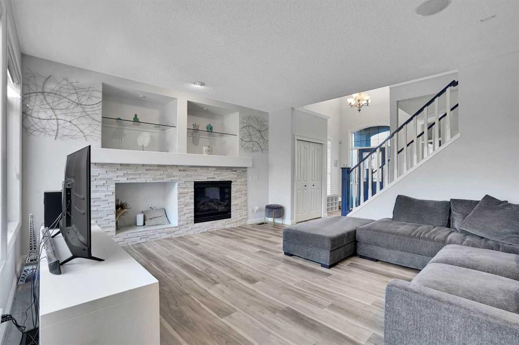 74 Cranleigh Green Se, Calgary, AB - Indoor Photo Showing Living Room With Fireplace