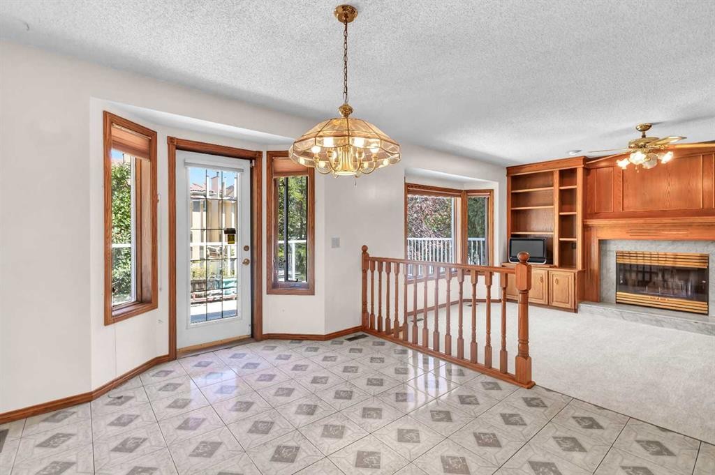 125 Edgebrook Road Nw, Calgary, AB - Indoor Photo Showing Other Room With Fireplace