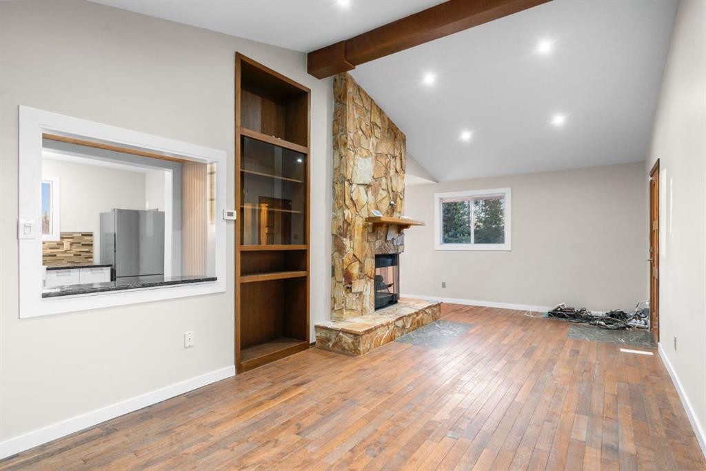 17 Gibson Road, Benchlands, AB - Indoor Photo Showing Other Room With Fireplace