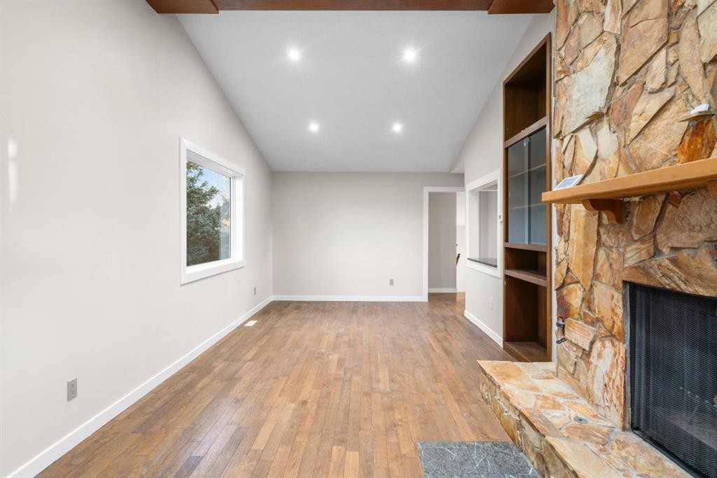 17 Gibson Road, Benchlands, AB - Indoor Photo Showing Other Room With Fireplace
