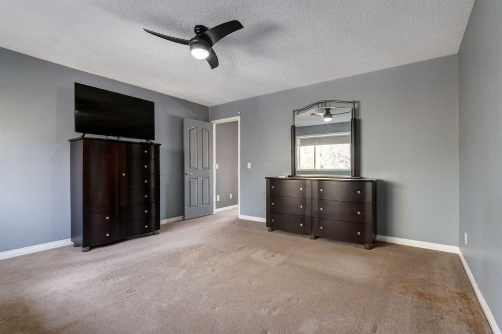 10 Chapala Road Se, Calgary, AB - Indoor Photo Showing Bedroom