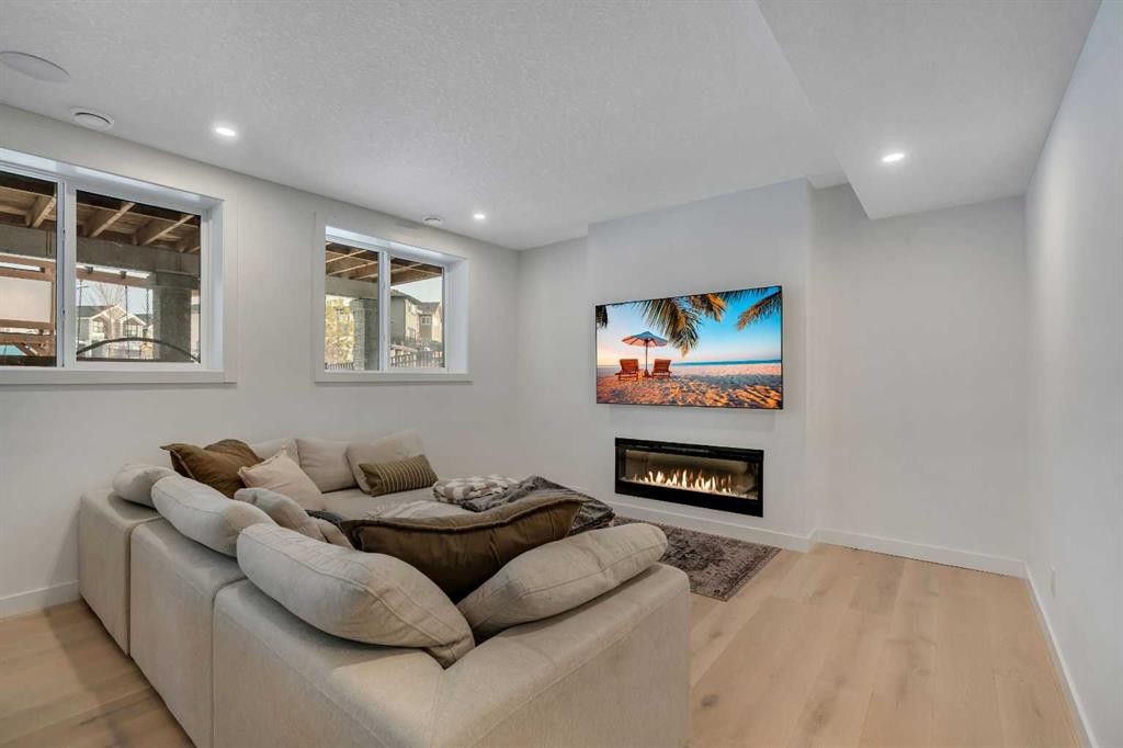 1176 Cranbrook Gardens Se, Calgary, AB - Indoor Photo Showing Living Room With Fireplace