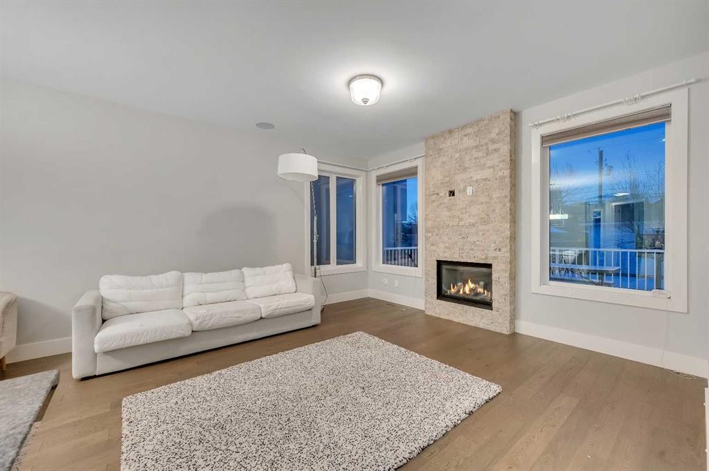 1708 23 Avenue Nw, Calgary, AB - Indoor Photo Showing Living Room With Fireplace