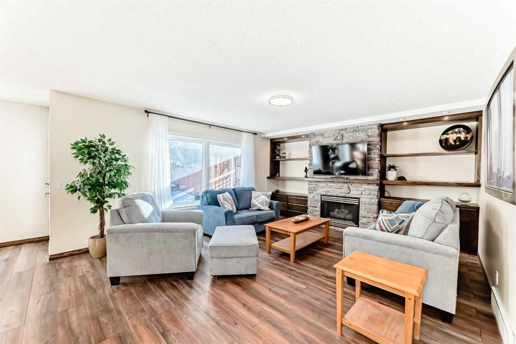 205 Patterson Hill Sw, Calgary, AB - Indoor Photo Showing Living Room With Fireplace