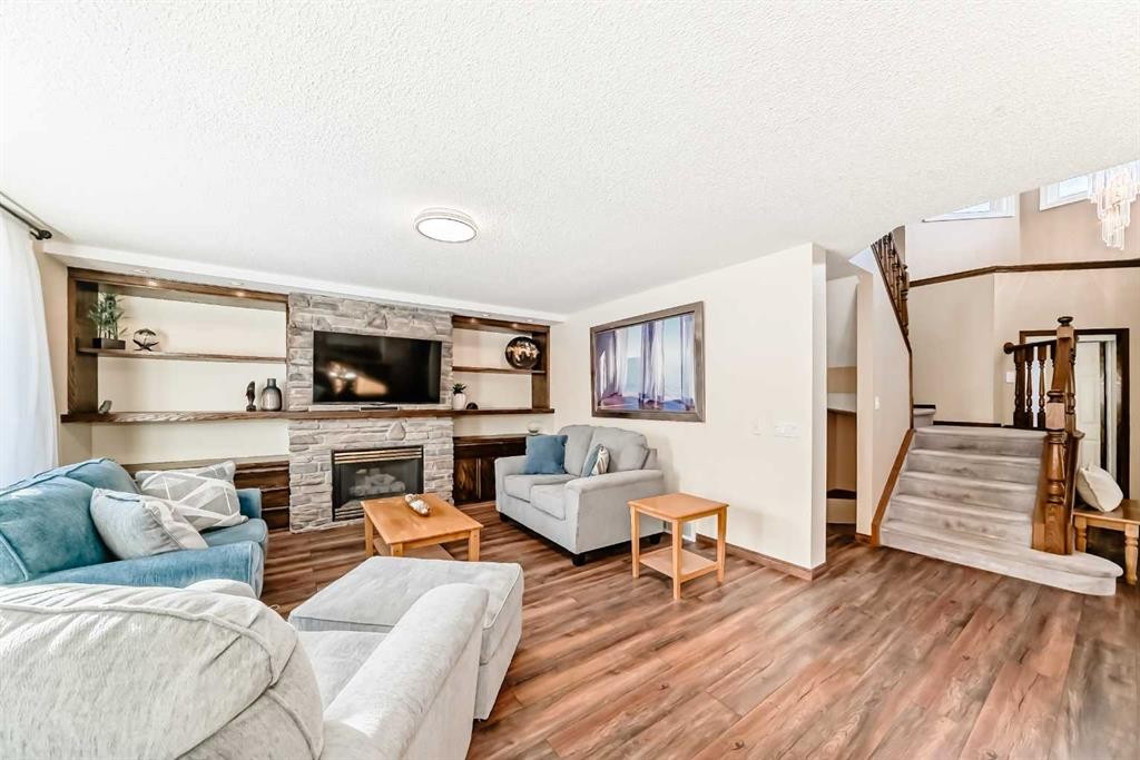 205 Patterson Hill Sw, Calgary, AB - Indoor Photo Showing Living Room With Fireplace