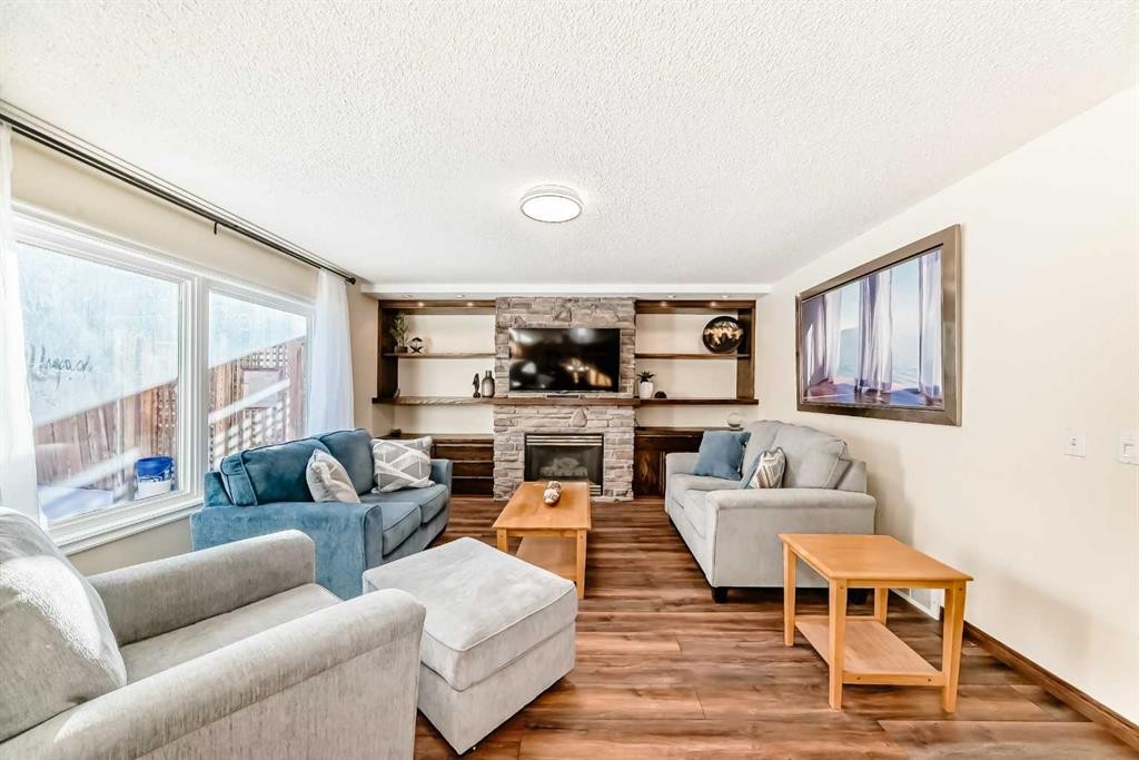 205 Patterson Hill Sw, Calgary, AB - Indoor Photo Showing Living Room With Fireplace