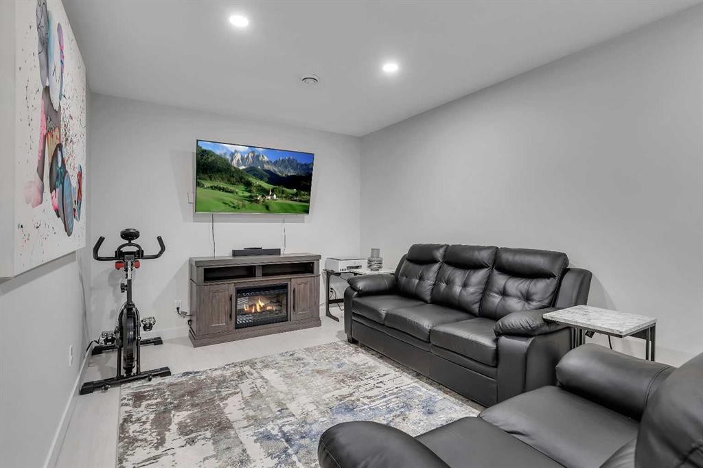 225 Cornerstone Manor Ne, Calgary, AB - Indoor Photo Showing Living Room With Fireplace